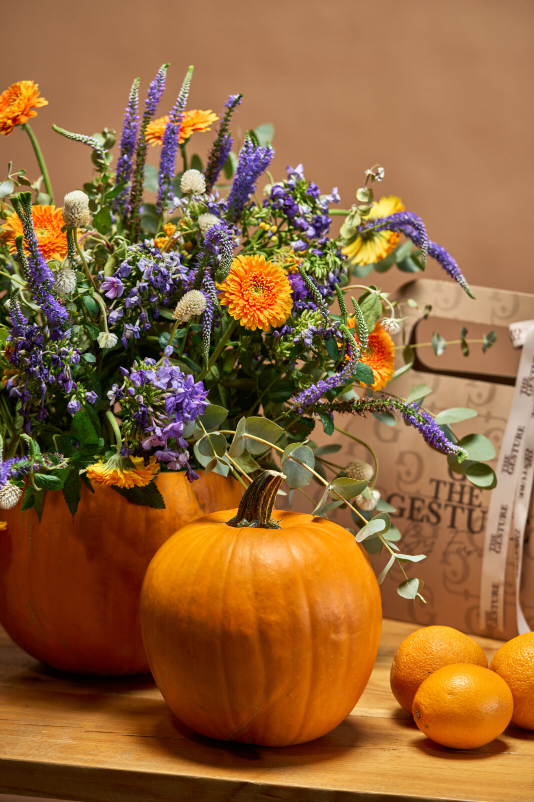 Fall flowers with pumpkins and oranges by The Gesture